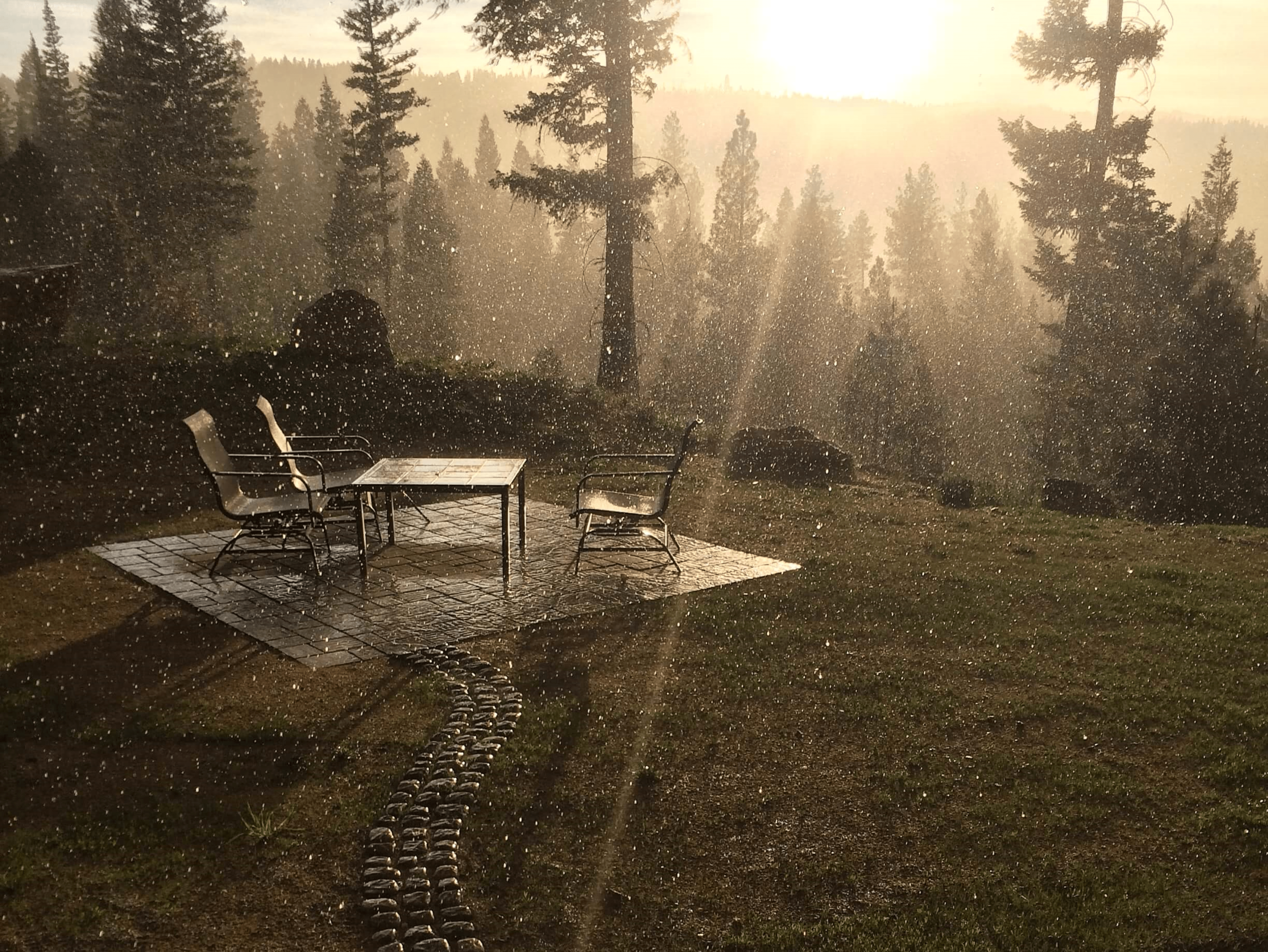 window view of sunset over a patio